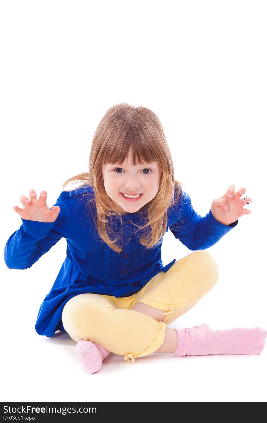 Blonde funny scaring little girl sitting looking at camera