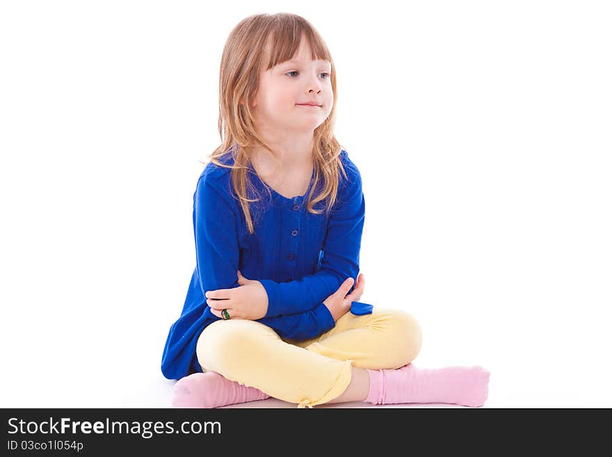 Blonde beautiful smiling little girl sitting. Blonde beautiful smiling little girl sitting