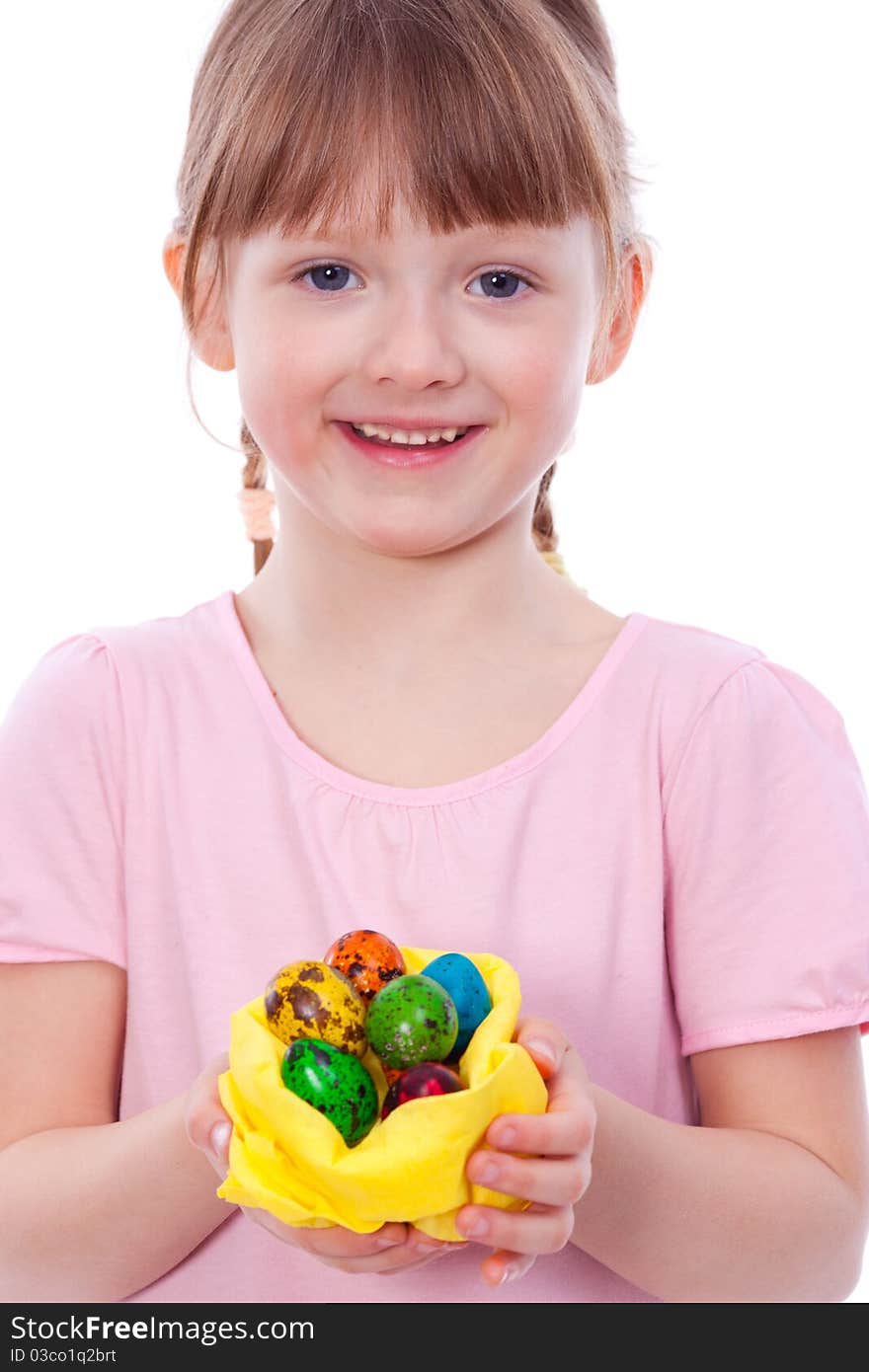 Smiling girl with Easter eggs at hands looking at camera