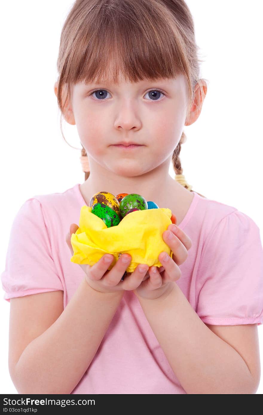 Cute girl with Easter eggs at hands looking at camera