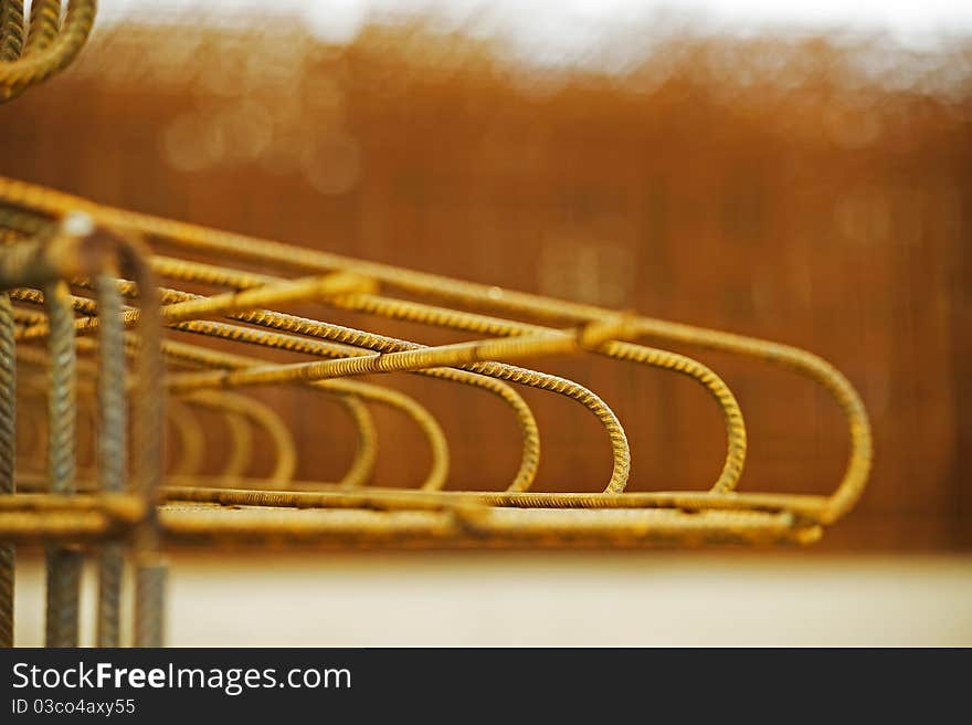 yellow colored concrete reinforcement against yellow background. yellow colored concrete reinforcement against yellow background