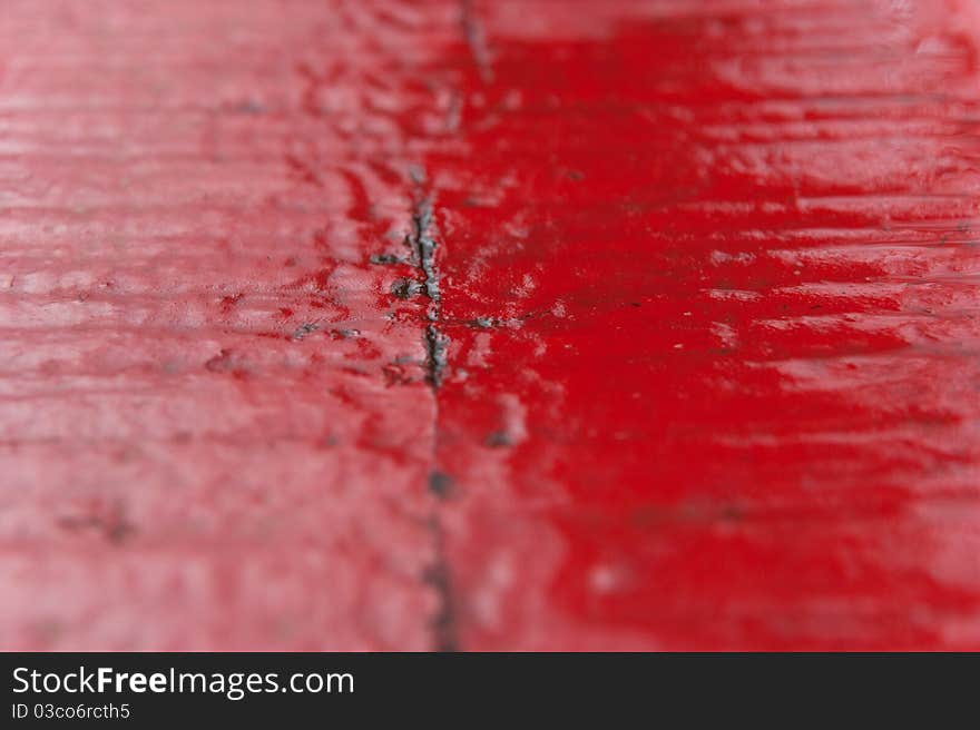 Red dewy wood surface