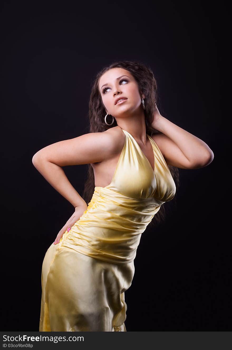 Beauty woman in yellow cloth with curly hair