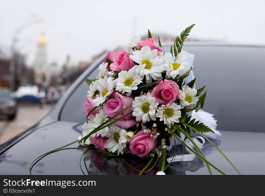 Wedding bouquet, background a church