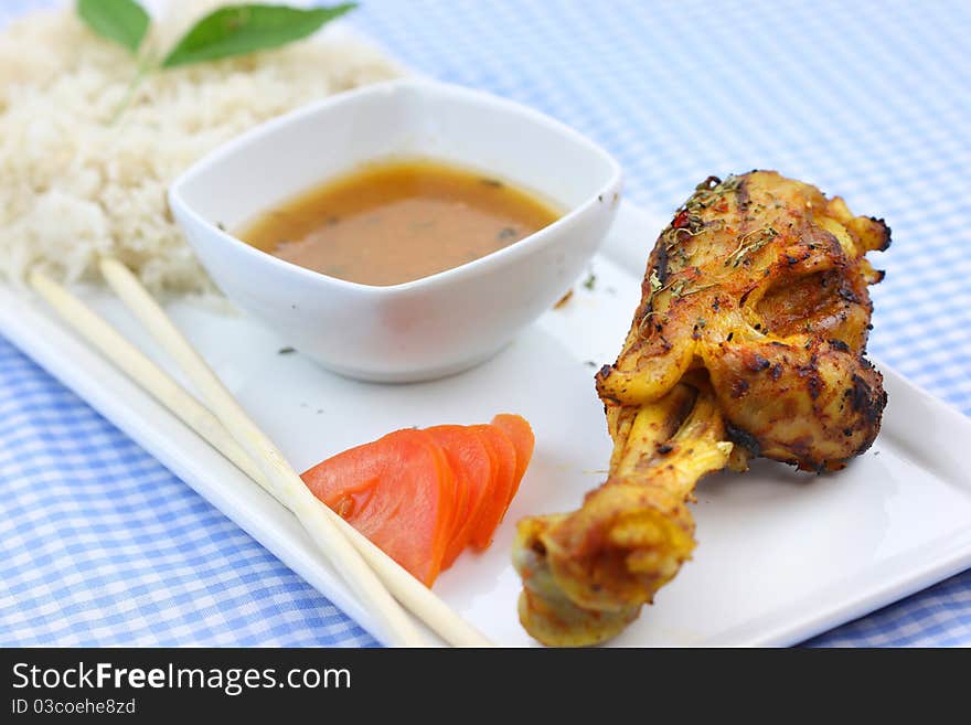 Chicken drum stick with curry sauce and rice. Chicken drum stick with curry sauce and rice