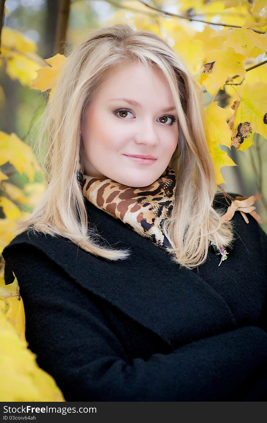 Autumn portrait of blonde girl