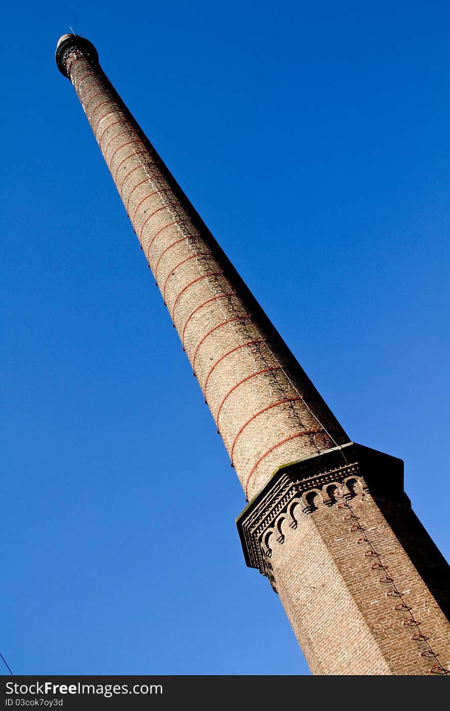 Old factory chimney reaching for the sky