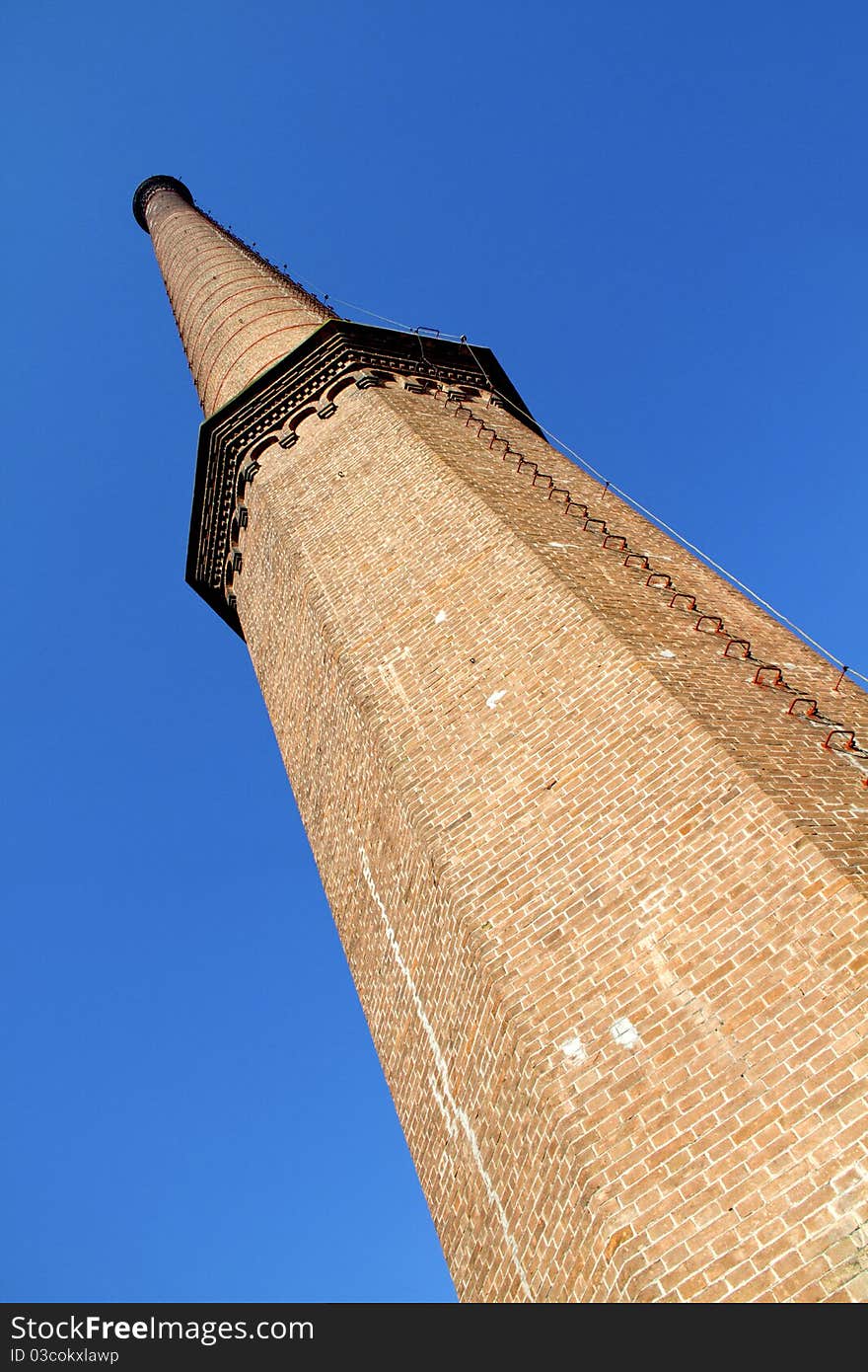 Old factory chimney reaching for the sky