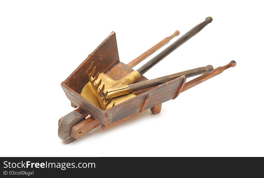 Miniature model of the wheelbarrow with tools