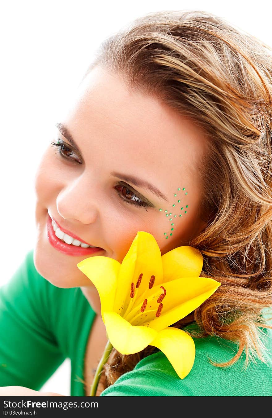 Attractive young girl with a yellow flower. Attractive young girl with a yellow flower