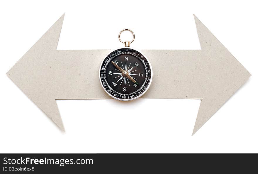 Cardboard navigation arrows with compass on a white background