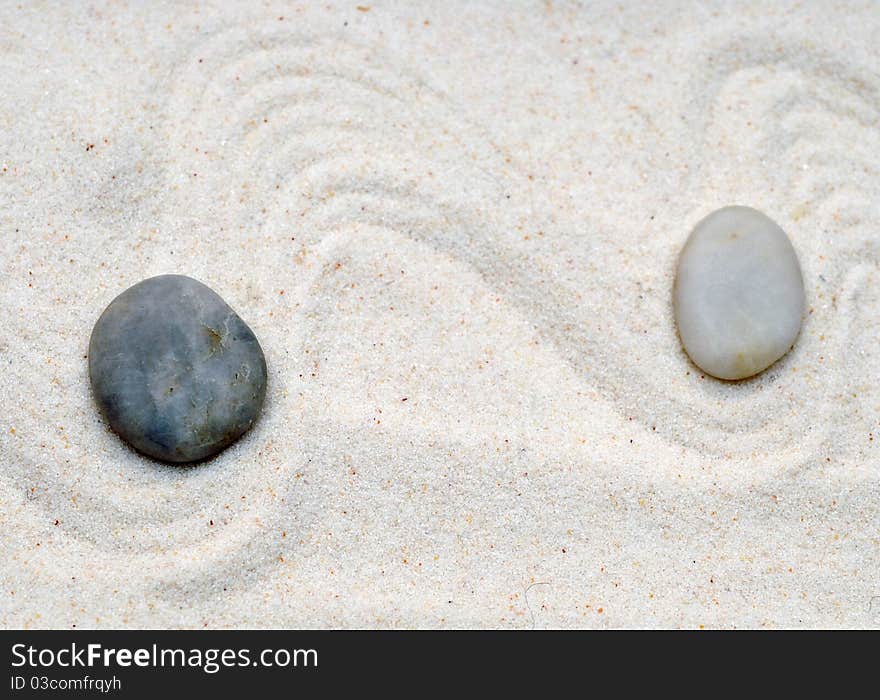 Two stones in the sand. Two stones in the sand