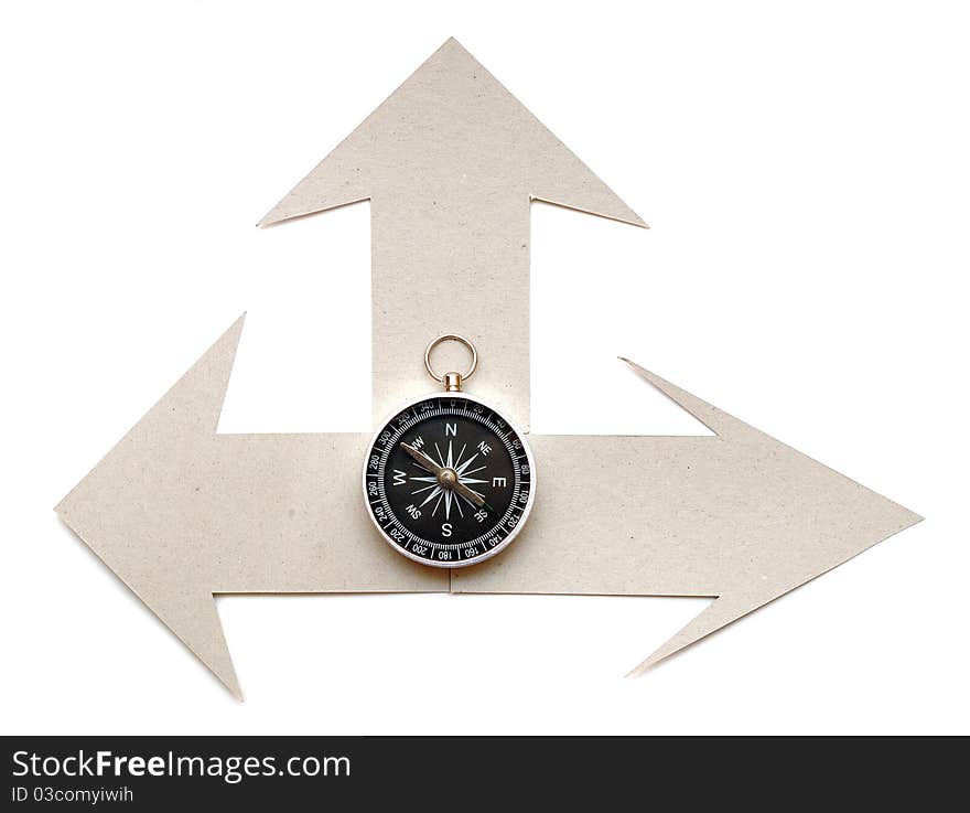 Cardboard navigation arrows with compass on a white background