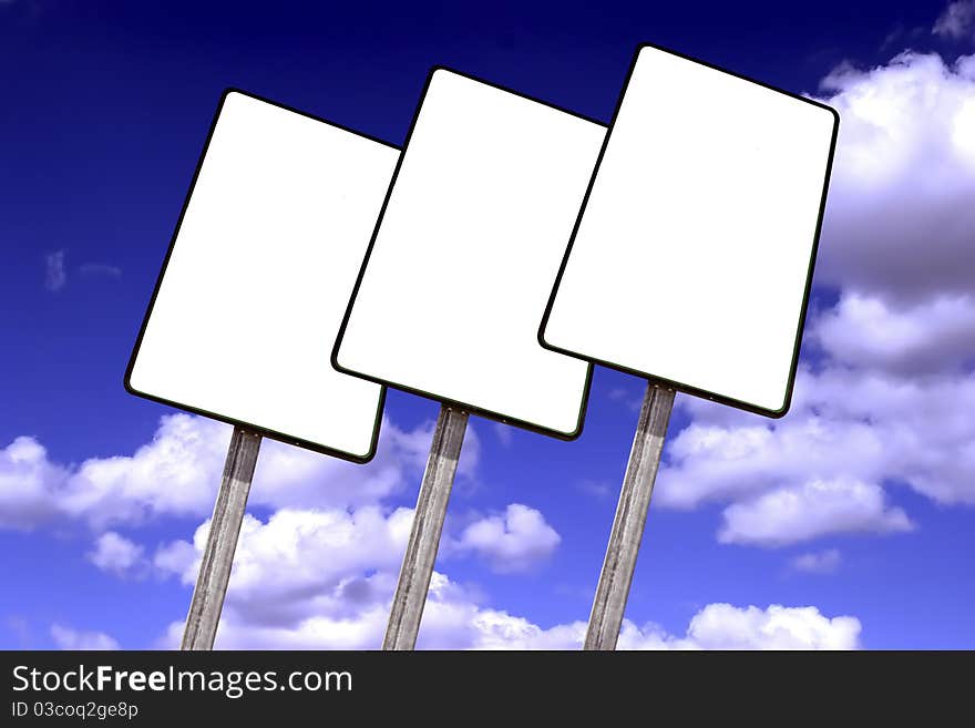 Empty billboard on a blue sky with clouds