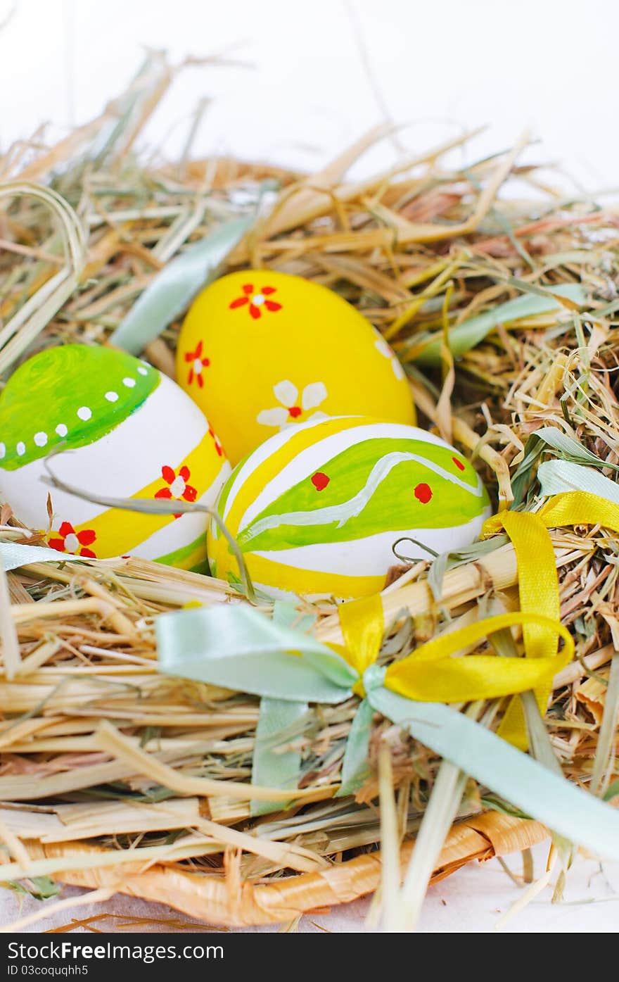 Closeup basket with colorful Easter Eggs isolated in studio