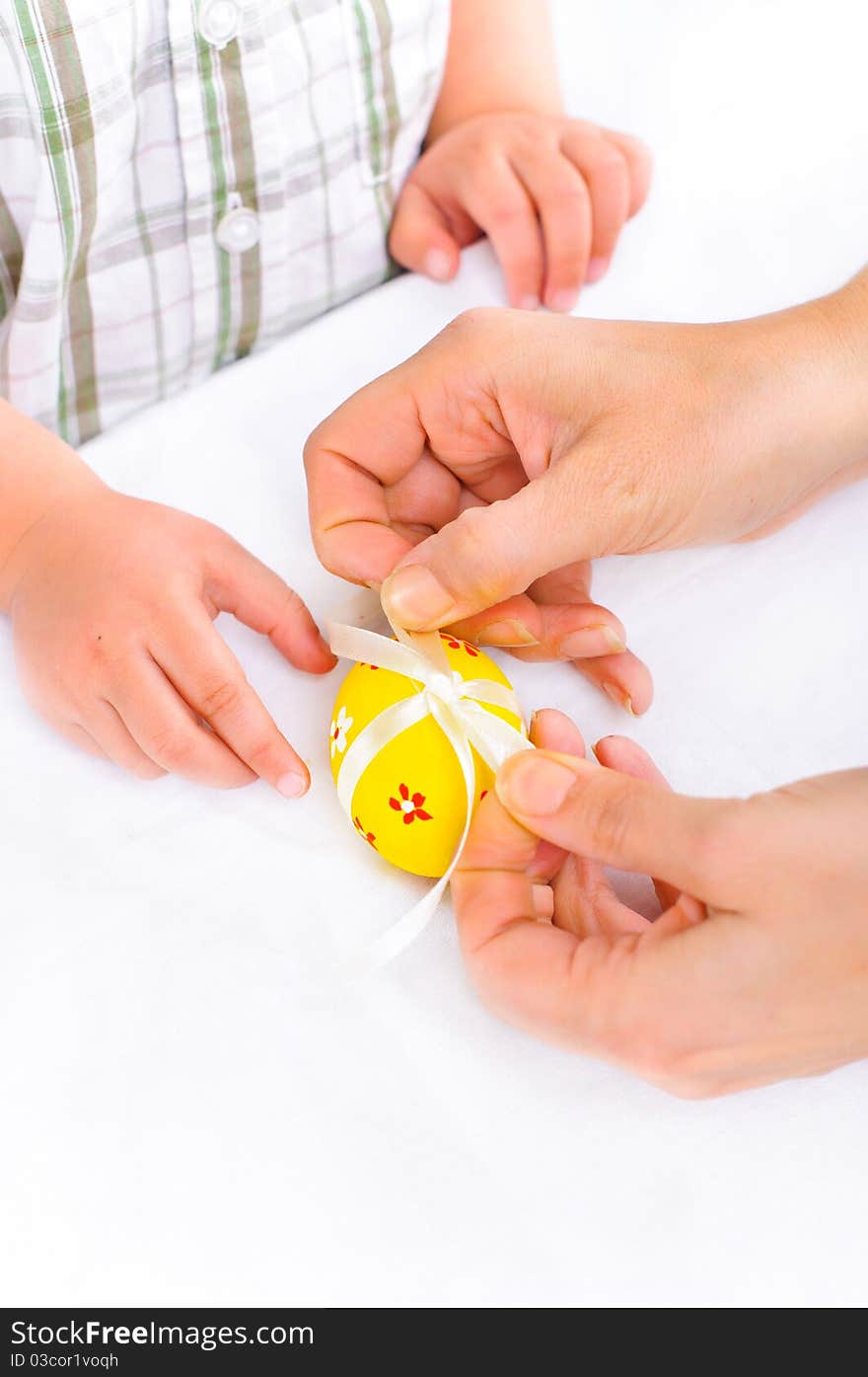 For Easter eggs. Women's and children's hands close-up