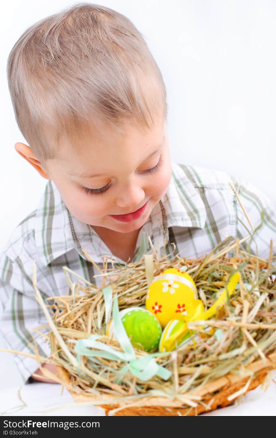 Little Boy With Easter Eggs In Basket