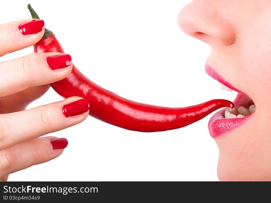 A red pepper is placed in the mouth. A red pepper is placed in the mouth