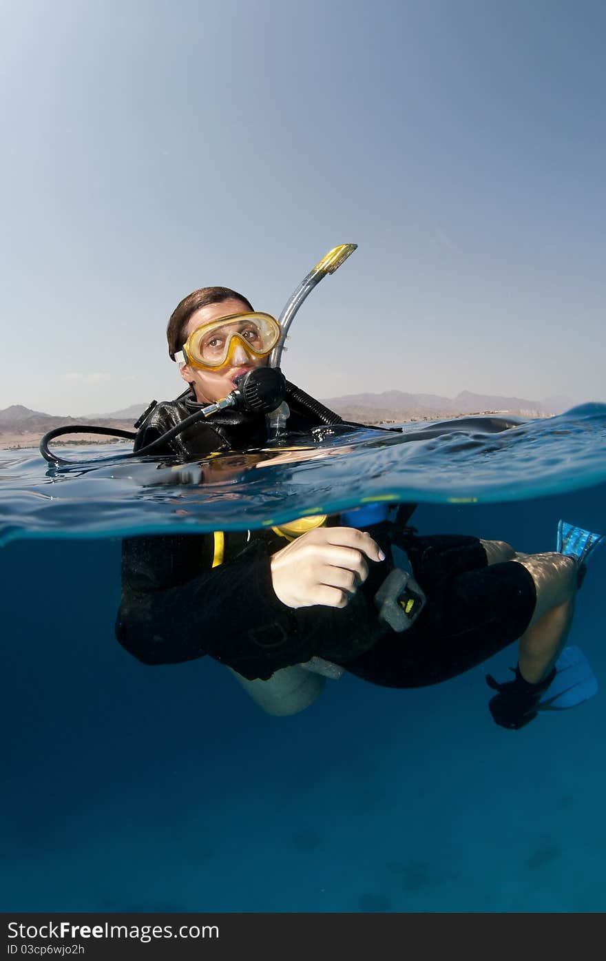 Female scuba diver on the surface