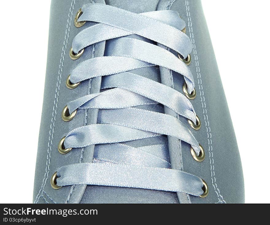 Blue ribbon shoe lacing on white background. Blue ribbon shoe lacing on white background