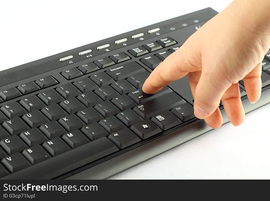 Hand on the black keyboard isolated on white. Hand on the black keyboard isolated on white.