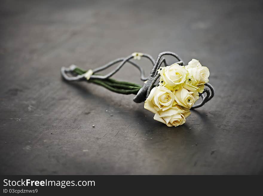 yellow colored wedding flowers on grey floor. yellow colored wedding flowers on grey floor