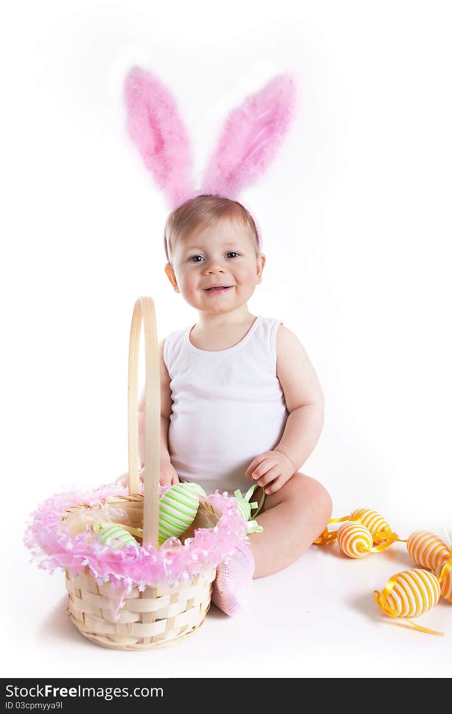 Baby playing with her first Easter basket. Baby playing with her first Easter basket