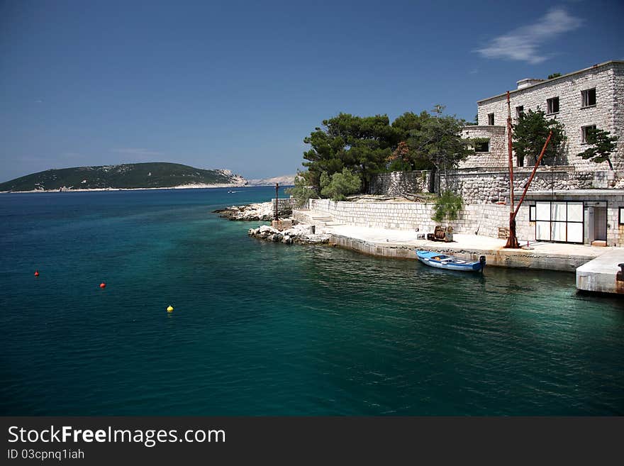 Close up view to port with boat, croatian island Rab. Close up view to port with boat, croatian island Rab