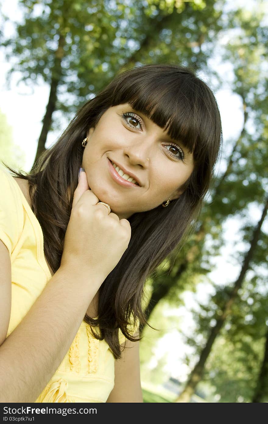 Beautiful young woman outdoors in nature. Portrait. Beautiful young woman outdoors in nature. Portrait