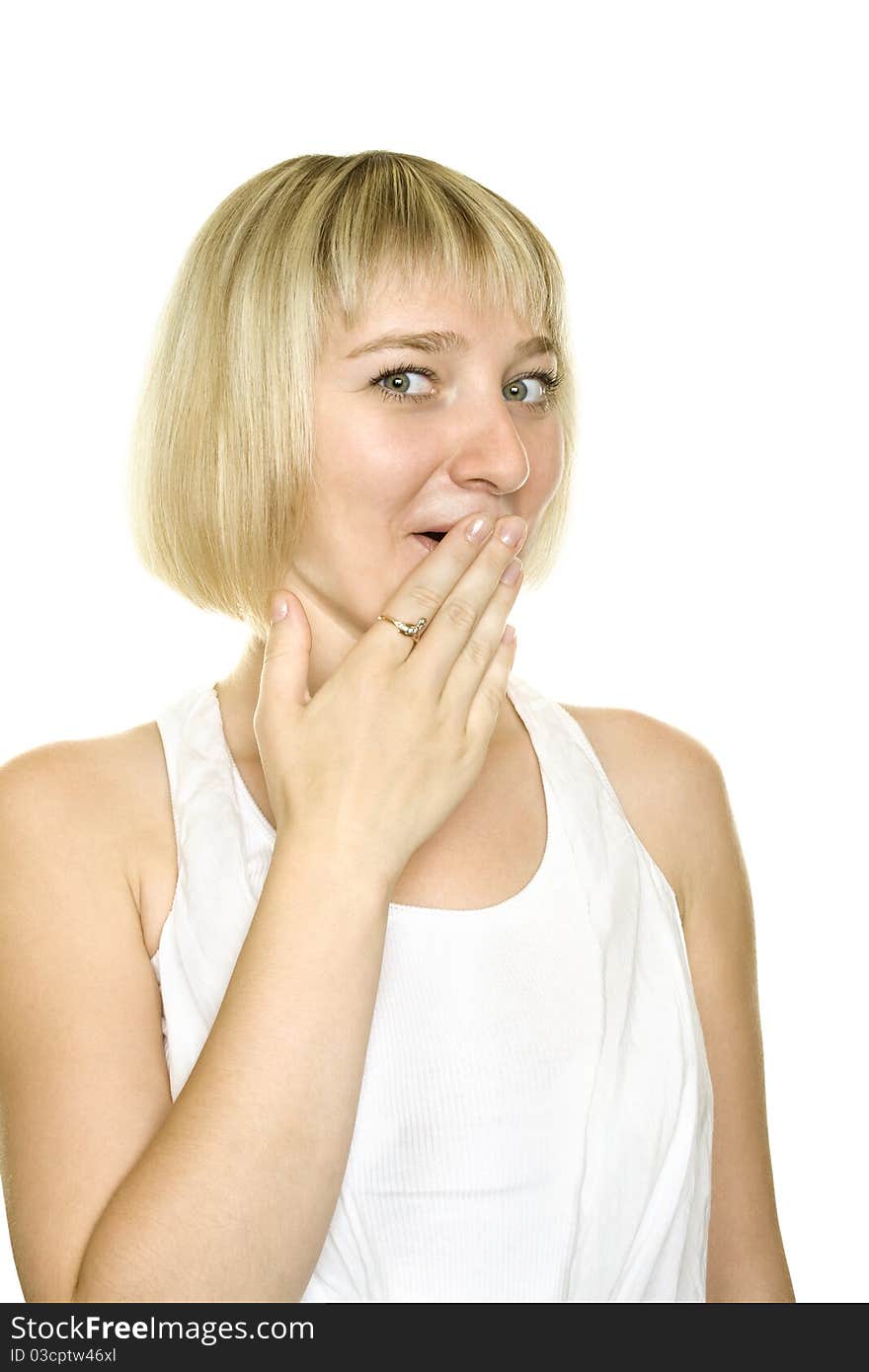 Close-up of a young woman looking surprised on white background