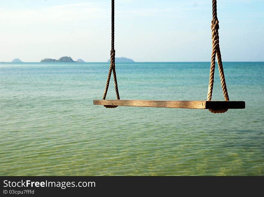 Swings sea beach background holiday