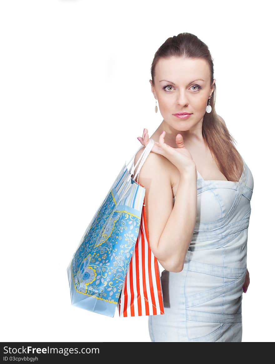 Girl with a package looking ahead on a white background