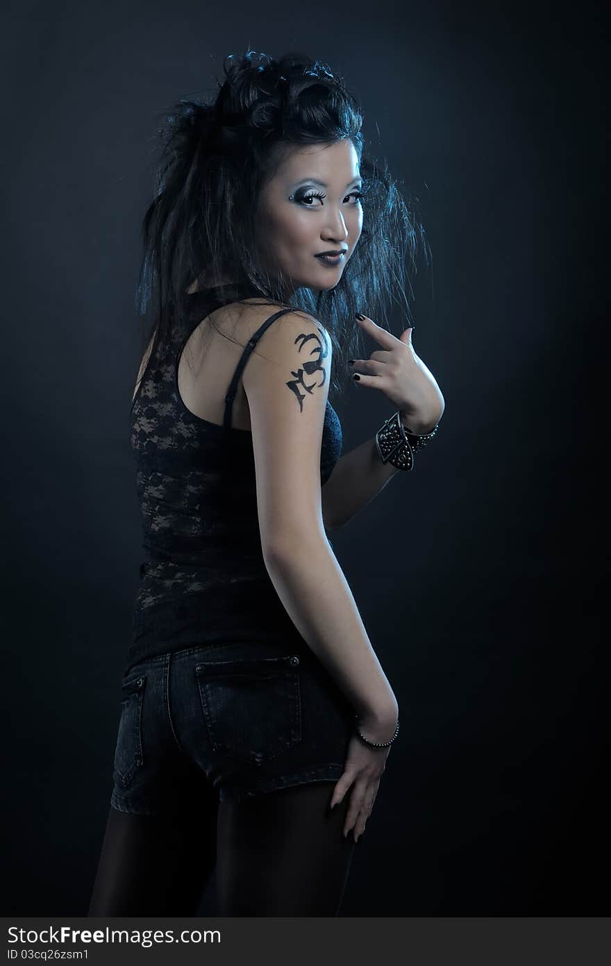 Gothic asian girl on black background