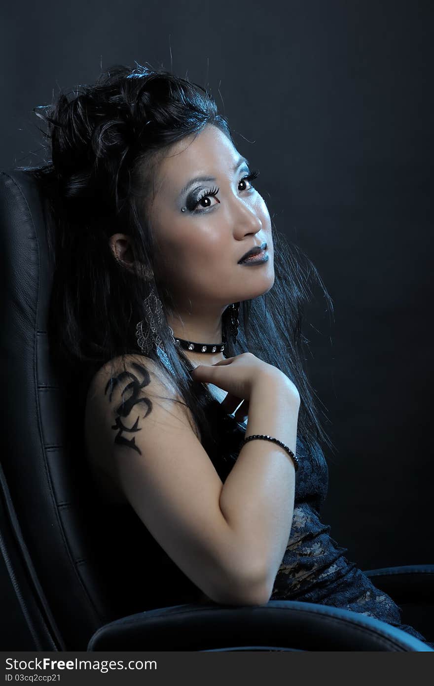 Gothic asian girl on black background