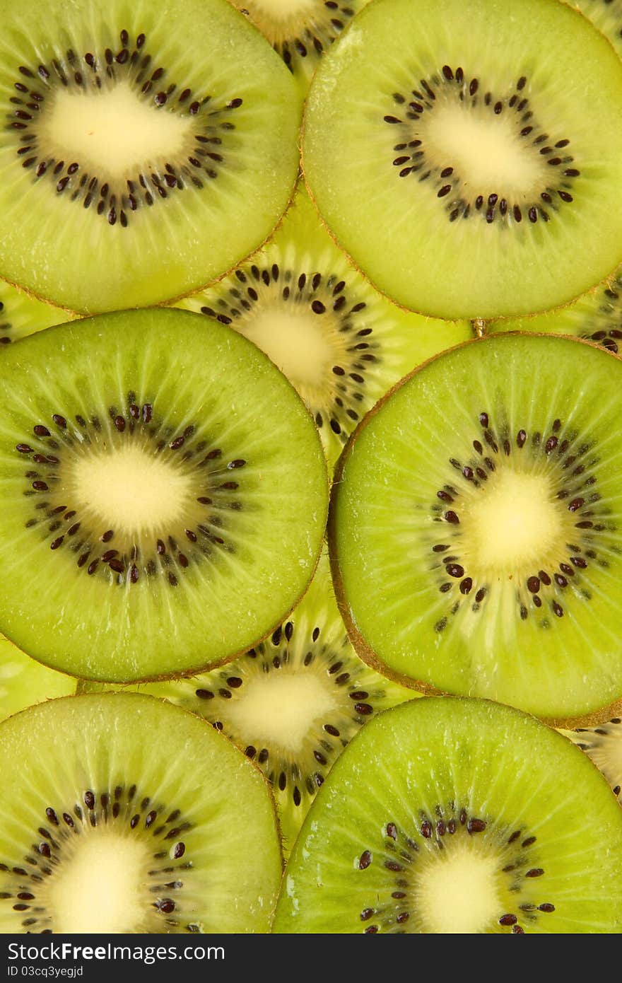 Sliced freshly kiwi on wheel.