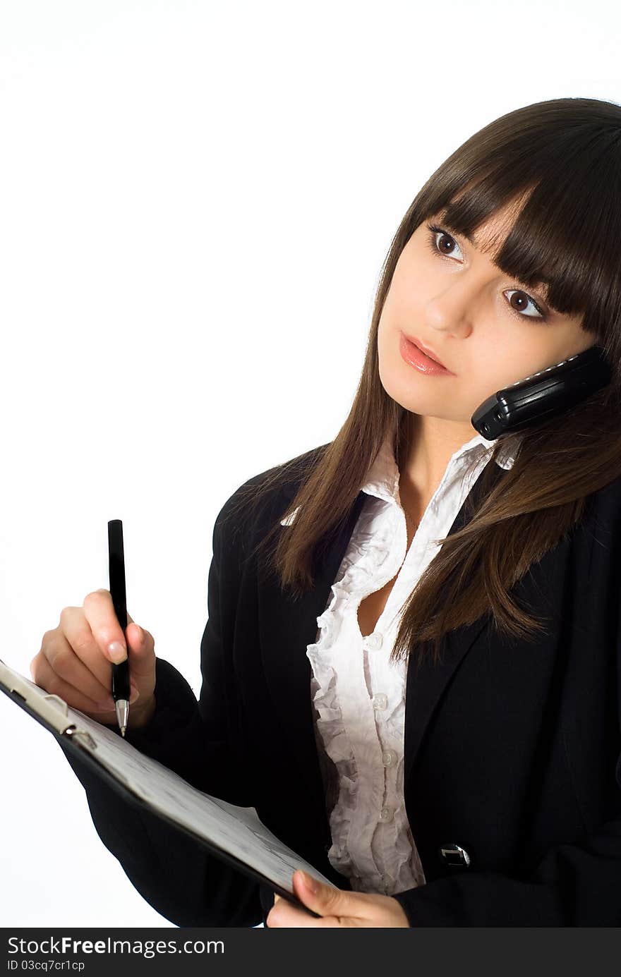 Nice girl in a business suit standing on white background