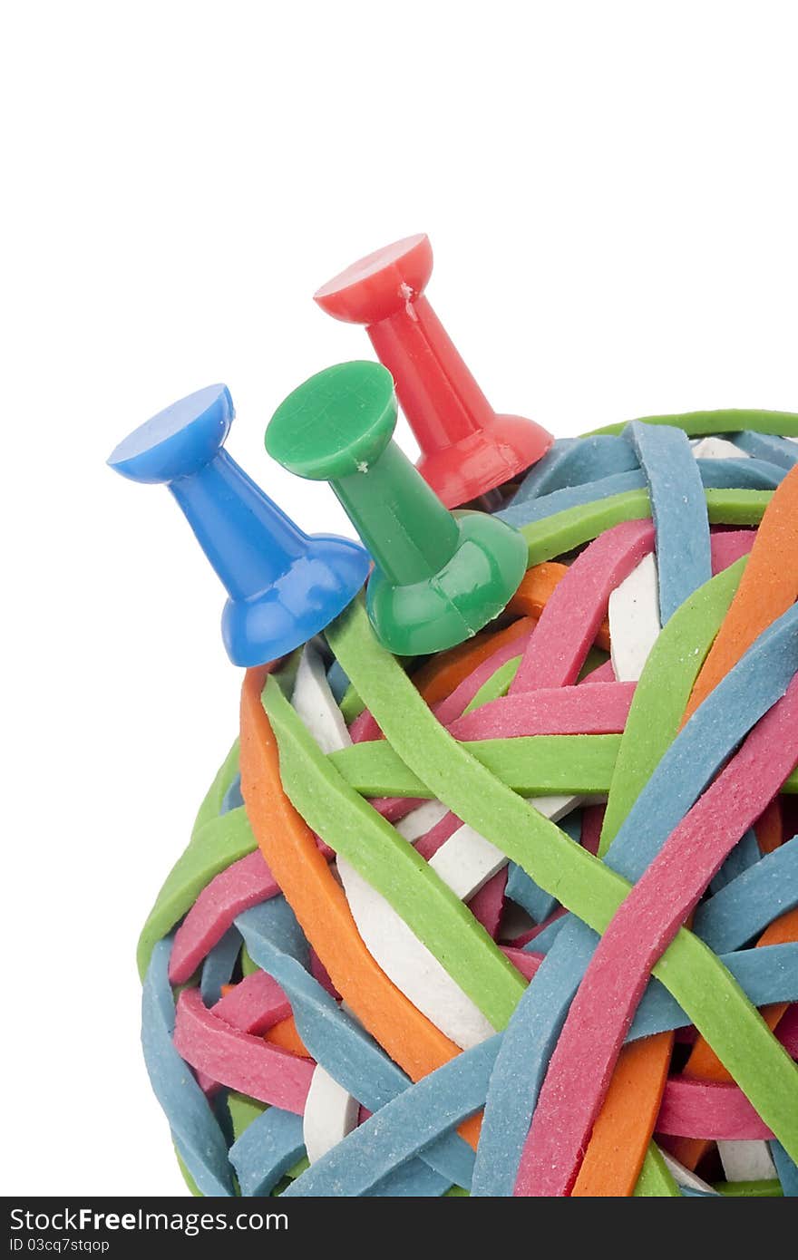 Rubber rings of different colors assembled for easy storage in a bowl with the office pins. Rubber rings of different colors assembled for easy storage in a bowl with the office pins.