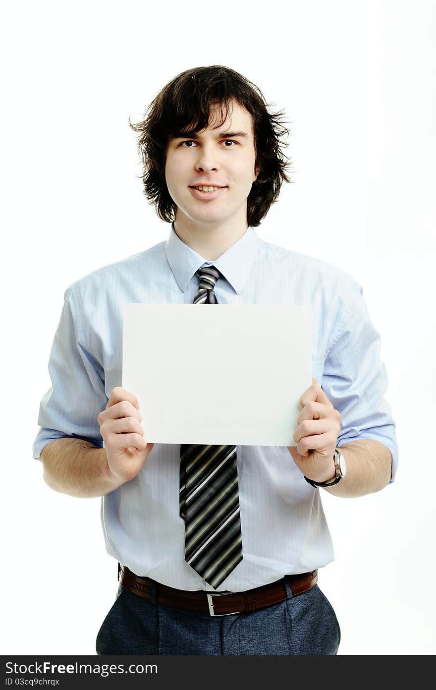 A young handsome man showing a sheet of paper. A young handsome man showing a sheet of paper