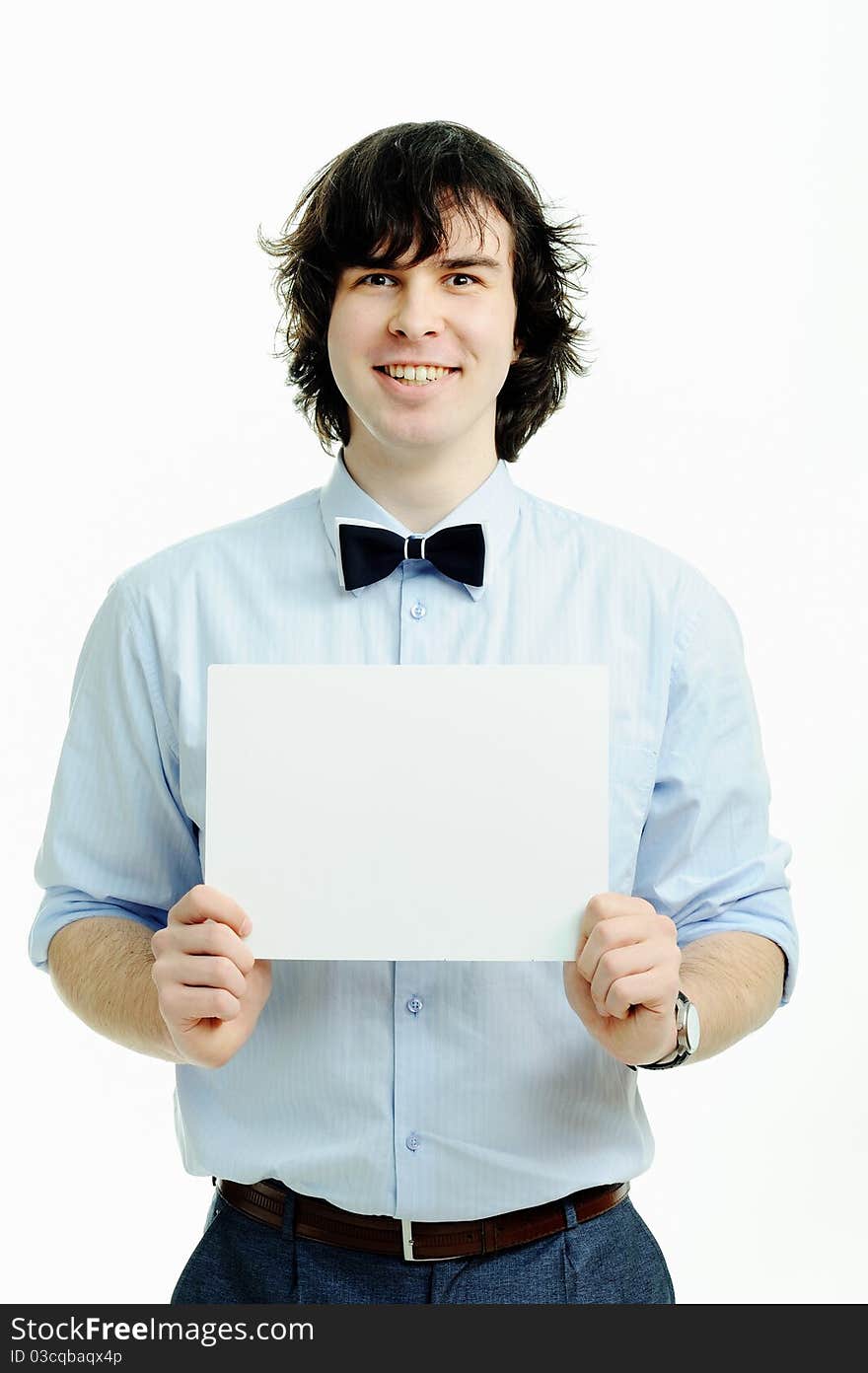 A young handsome man showing a sheet of paper. A young handsome man showing a sheet of paper