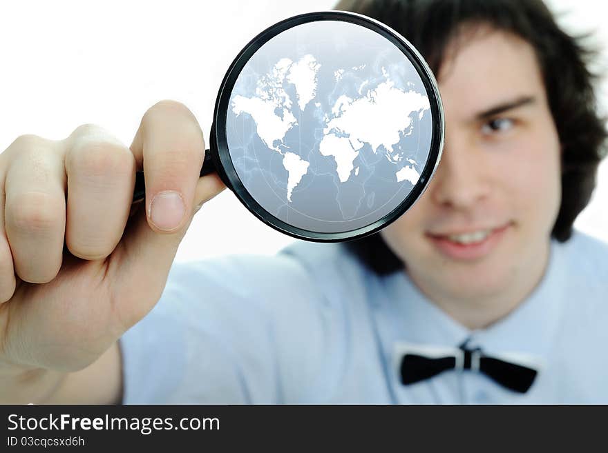 A young man with a magnifier with map in it