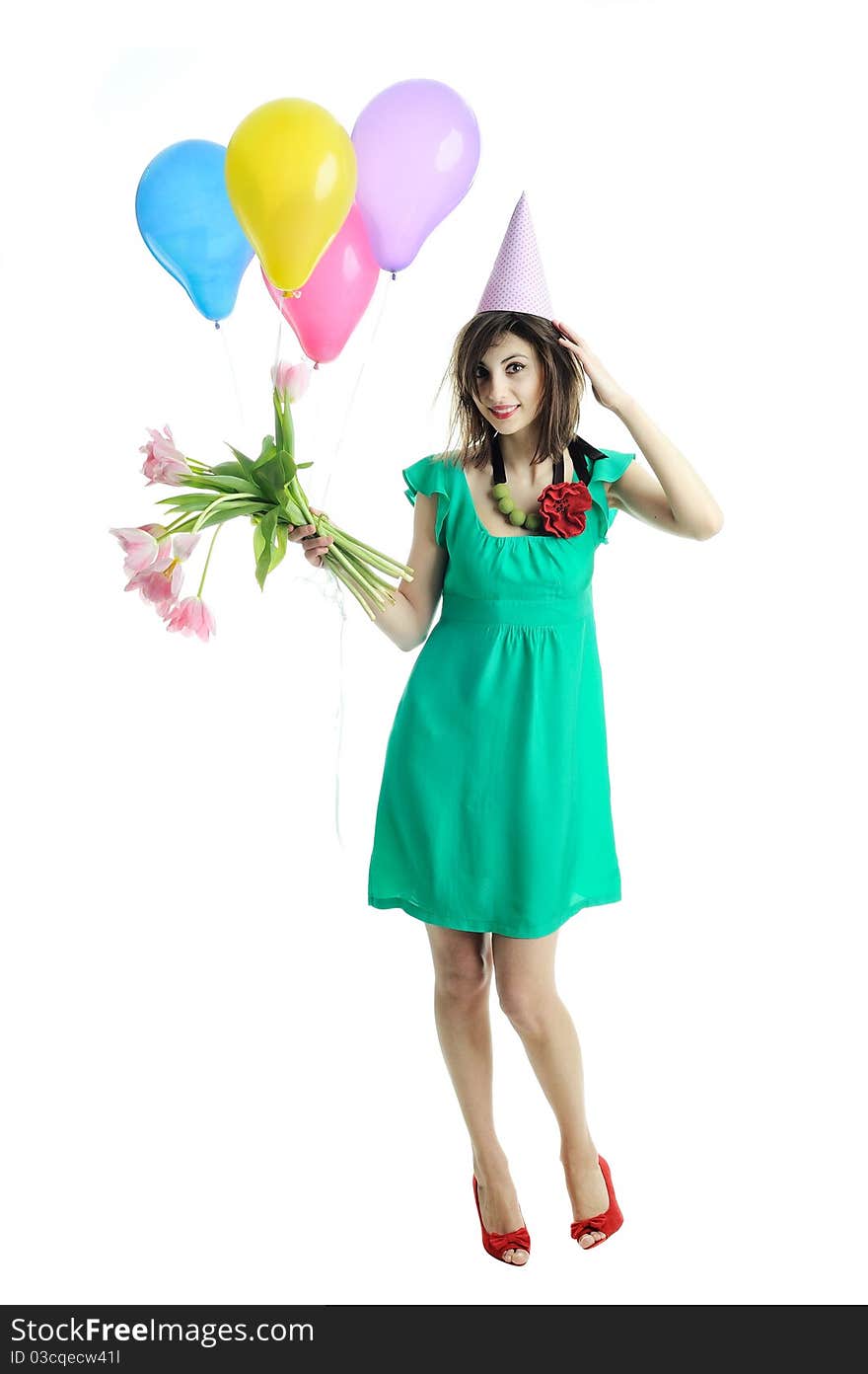 A young beautiful woman with flowers and balloons. A young beautiful woman with flowers and balloons