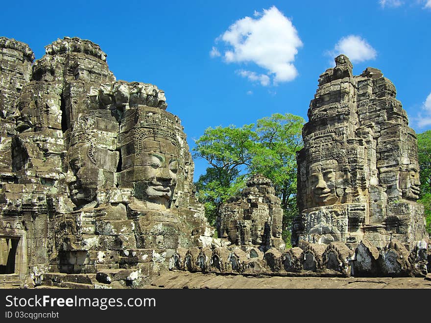 Stone head on towers of Bayon temple.