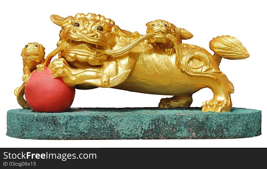 Golden lion statue form. The guard in a Chinese temple. Golden lion statue form. The guard in a Chinese temple