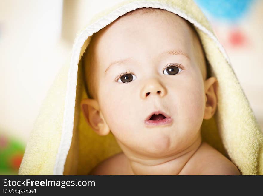 Baby Boy With Yellow Blanket On Head.