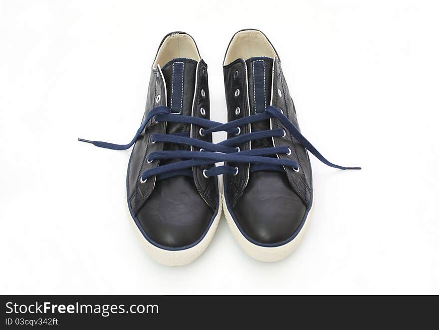 Sneakers laced a single cord