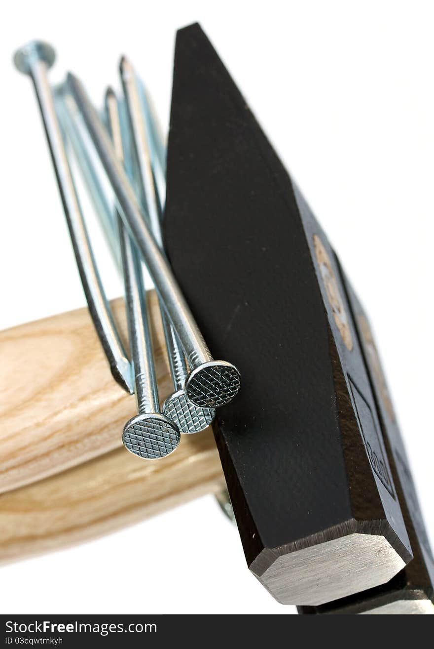 Macro of hammer and nails with mirror reflection. Macro of hammer and nails with mirror reflection