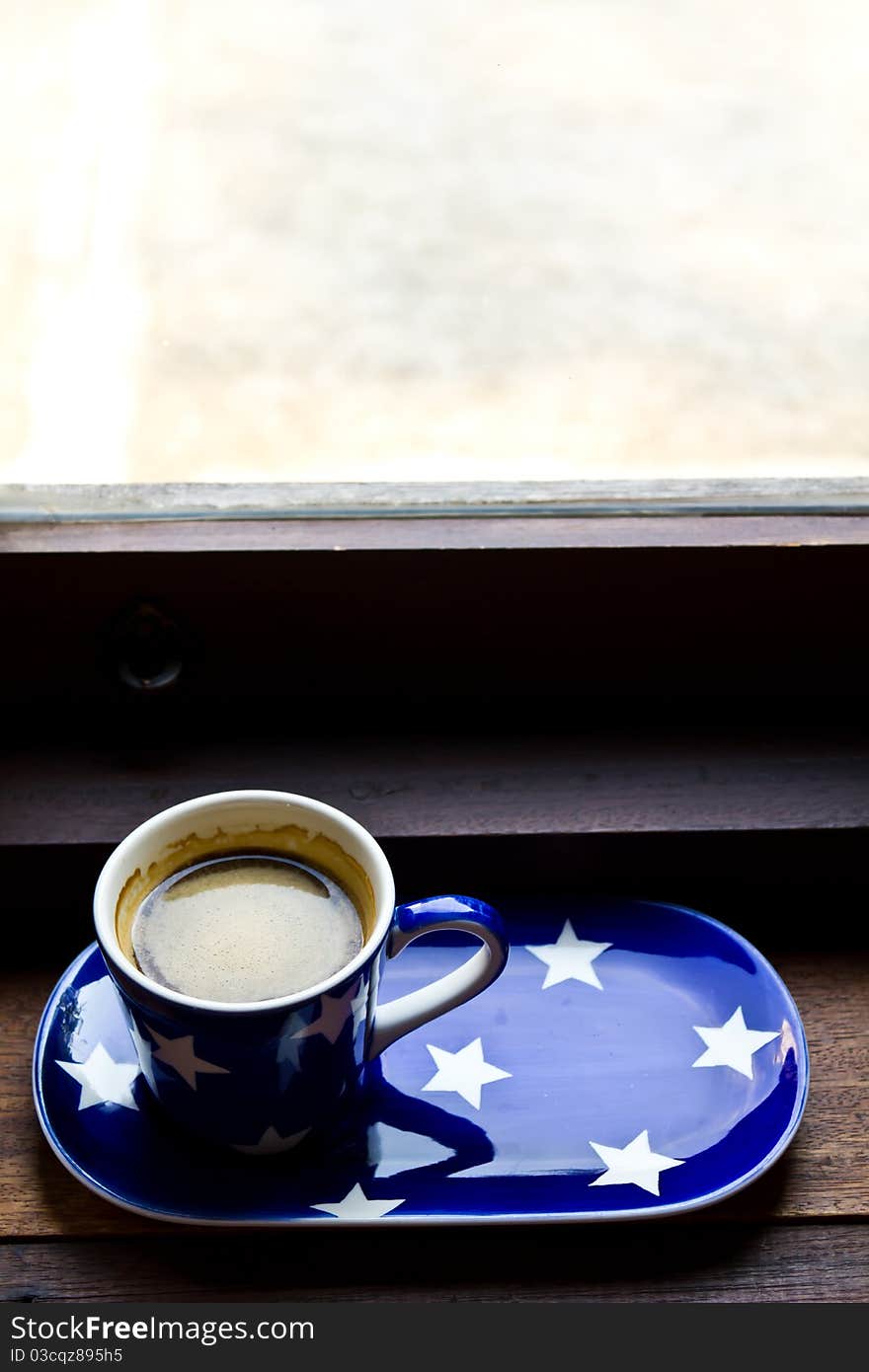 Cup of coffee near the window