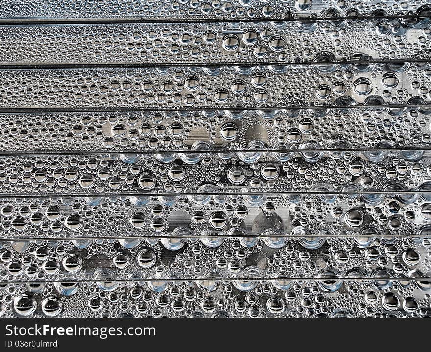 A lot of droplets on a swimming pool enclosure. A lot of droplets on a swimming pool enclosure