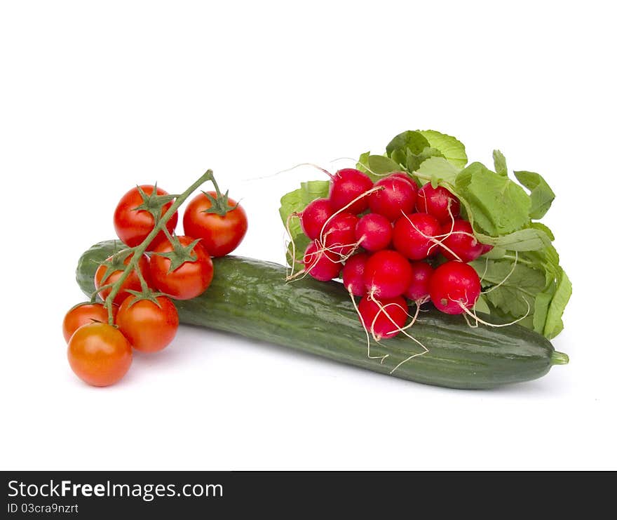 Tomatoes, cucumber and radishes isolated on white background. Tomatoes, cucumber and radishes isolated on white background