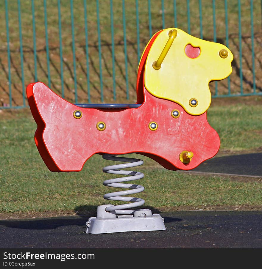 A Sprung Play Toy in a Childrens Playground Area. A Sprung Play Toy in a Childrens Playground Area.